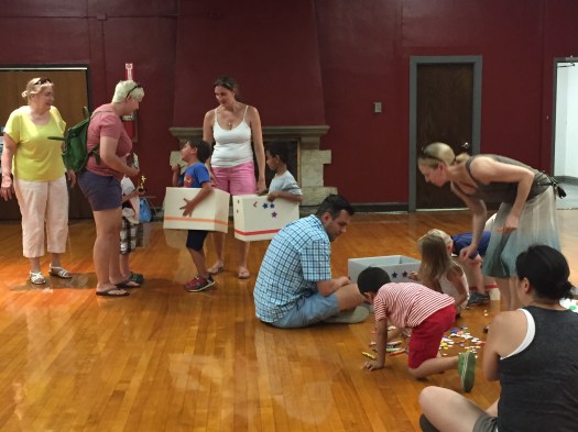 The racers decorate their cars.